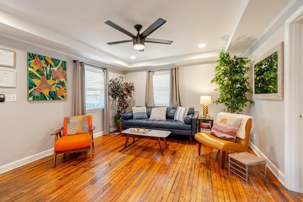 a living room with a couch and two chairs at Downtown WS bungalow Close to Everything in Winston-Salem