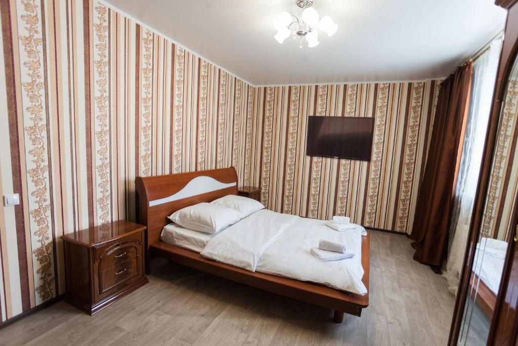 
Кровать или кровати в номере 2-rooms Apartment on Geologorazvedchikov
