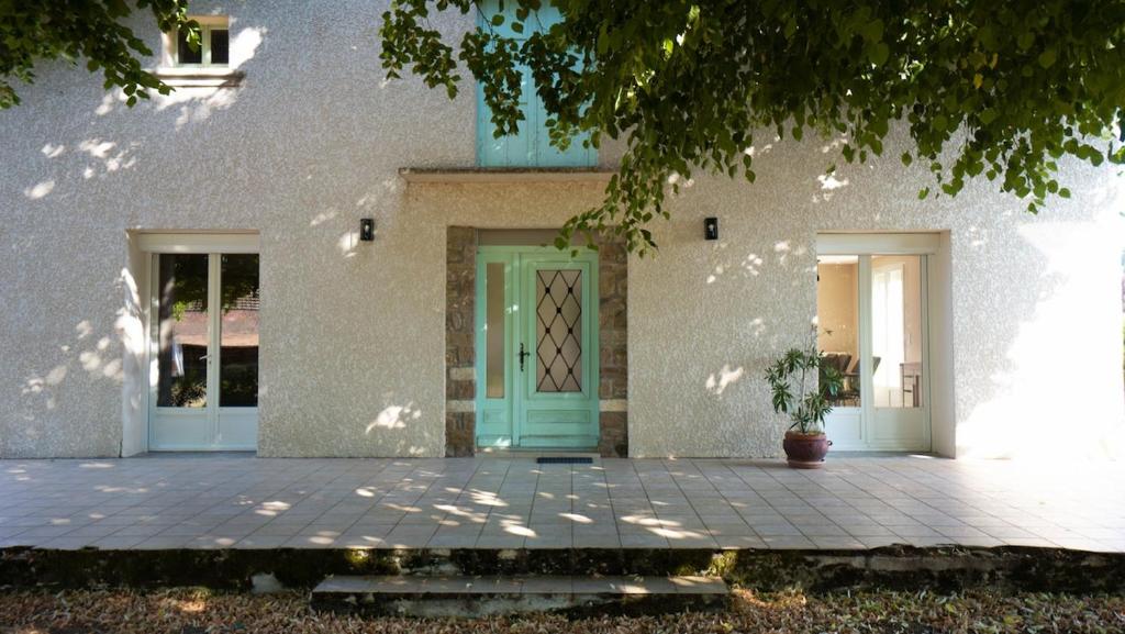 a front door of a house with a potted plant at La Maison Du Vigneron in Gaillac
