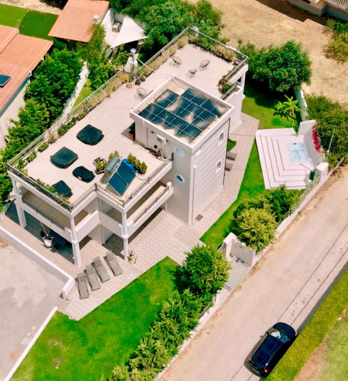 an aerial view of a house with a solarium at Airfenos - Athens Riviera in Anavyssos
