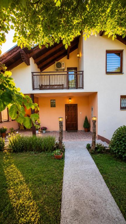 a house with a walkway in front of it at Hidden Haven Cottage Sarajevo in Lokve