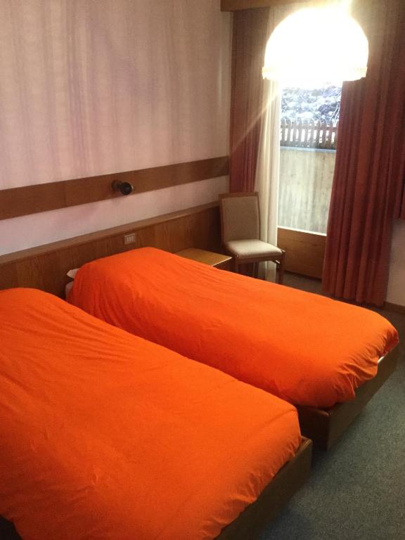 Postel nebo postele na pokoji v ubytování Hotel Alpenrose