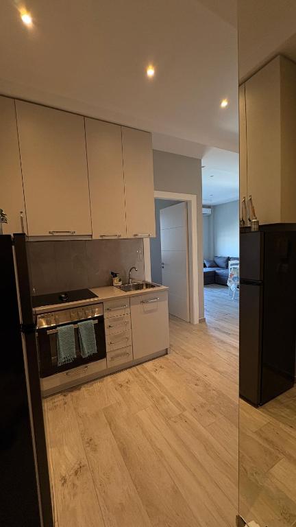 an empty kitchen with a stove and a refrigerator at Apartment in Golem in Golem
