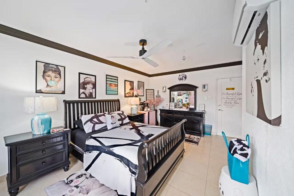 a bedroom with a bed and a desk and a mirror at Hidden Gem Classic Room - by ZenBreak in Christ Church