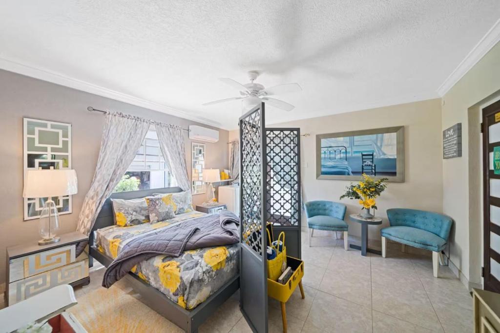a bedroom with a bed and a ceiling fan at Hidden Gem The Serenity - by ZenBreak in Christ Church