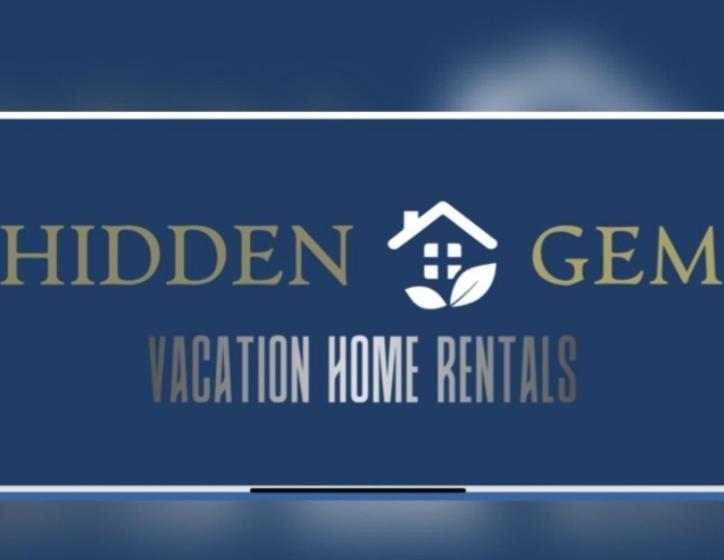 a sign that reads hidden gem k activation home rentals at Comfortable Modern Stays provided by Hidden Gem Vacation Homes in Zapotlanejo