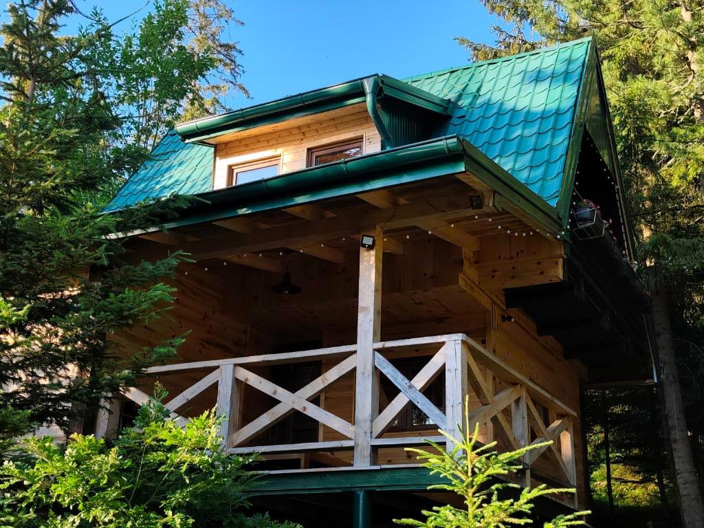 a tree house in the woods at Utopija Cabin by Vilovi Botić in Nova Varoš