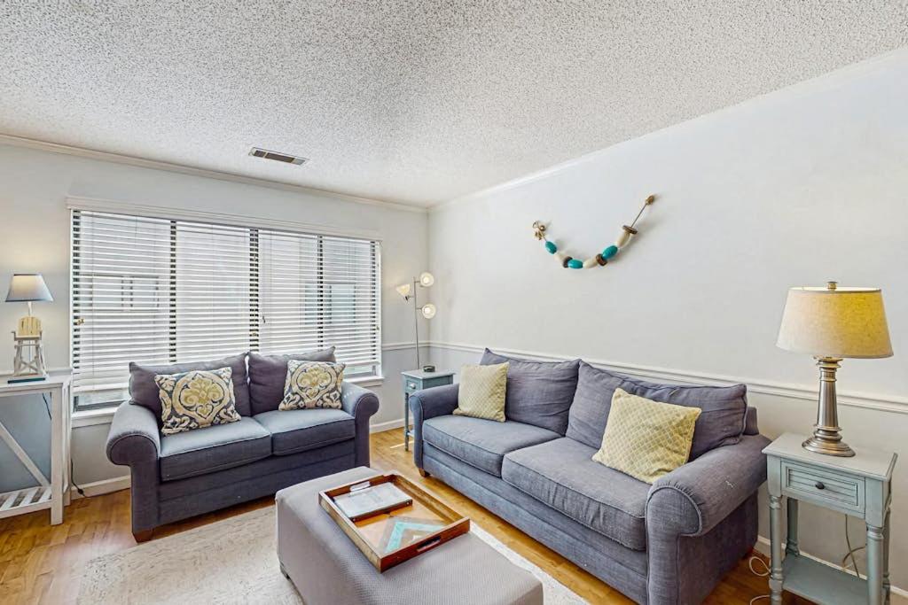 a living room with two couches and a table at Springwood Villas 51 in Hilton Head Island