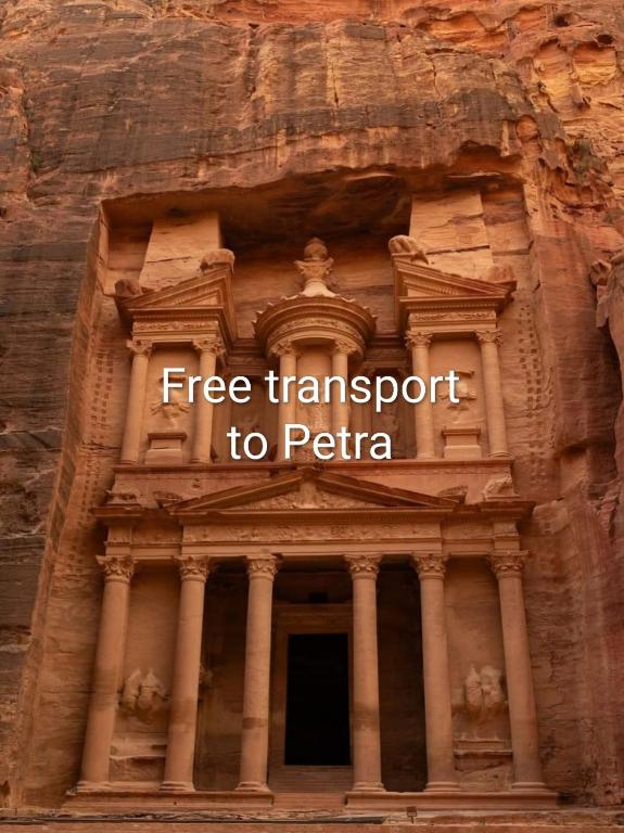 a building with the words free transport to pitteria at Petra Planet in Wadi Musa