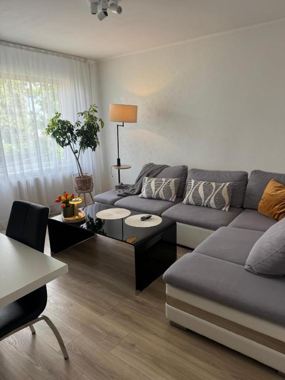 a living room with a couch and a table at Apartment Ventspils iela 22 in Rēzekne