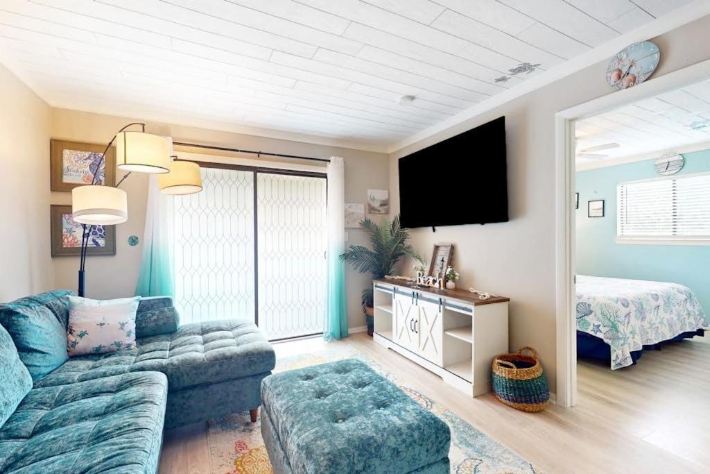 a living room with a couch and a bed at Fiddlers Cove 6J in Hilton Head Island