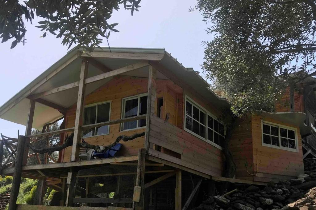 a house being built on a rock at Shepherds Cabin in Kadita - בקתת רועה בקדיתא in Kadita
