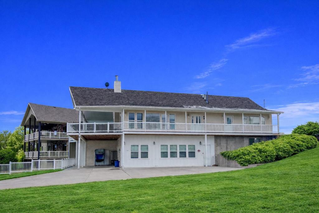 a large white house with a large yard at The Beach House I in Garden City