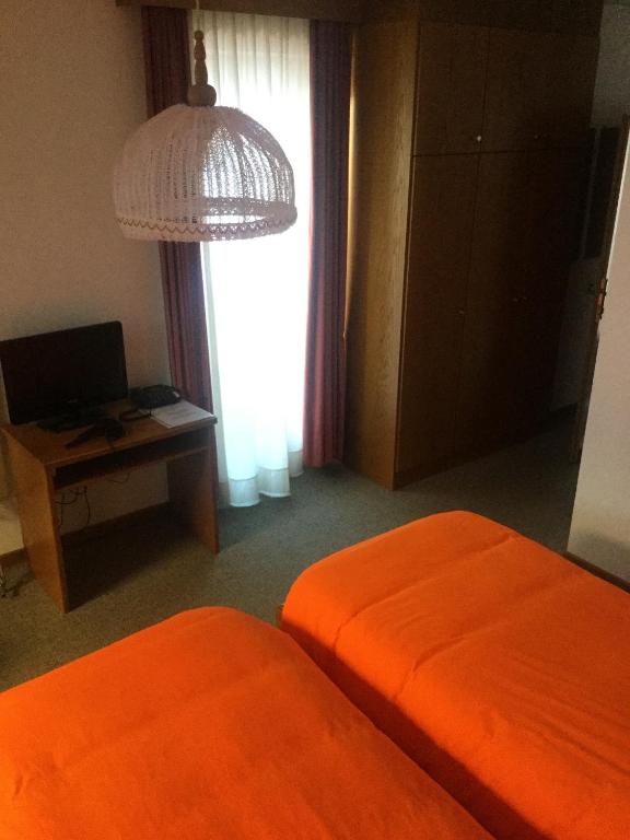 Postel nebo postele na pokoji v ubytování Hotel Alpenrose