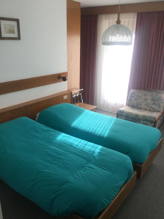 Postel nebo postele na pokoji v ubytování Hotel Alpenrose