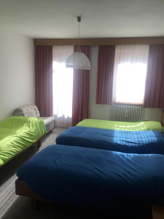 Postel nebo postele na pokoji v ubytování Hotel Alpenrose