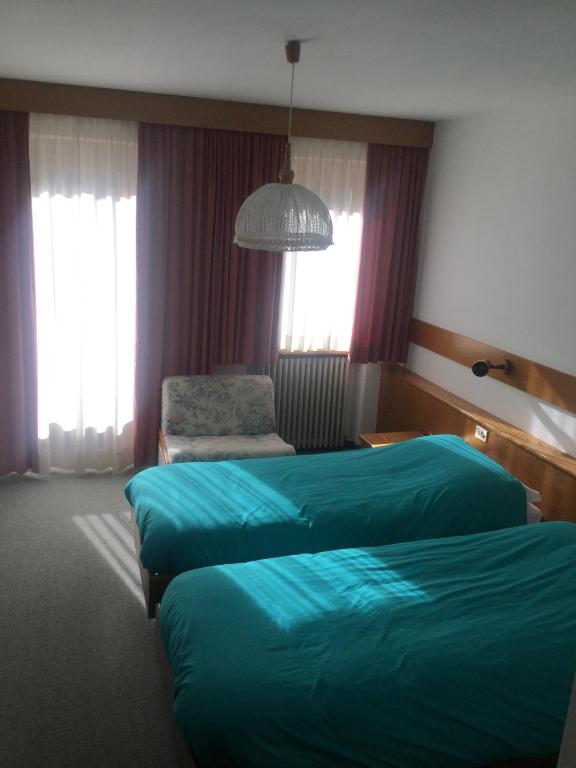 Postel nebo postele na pokoji v ubytování Hotel Alpenrose