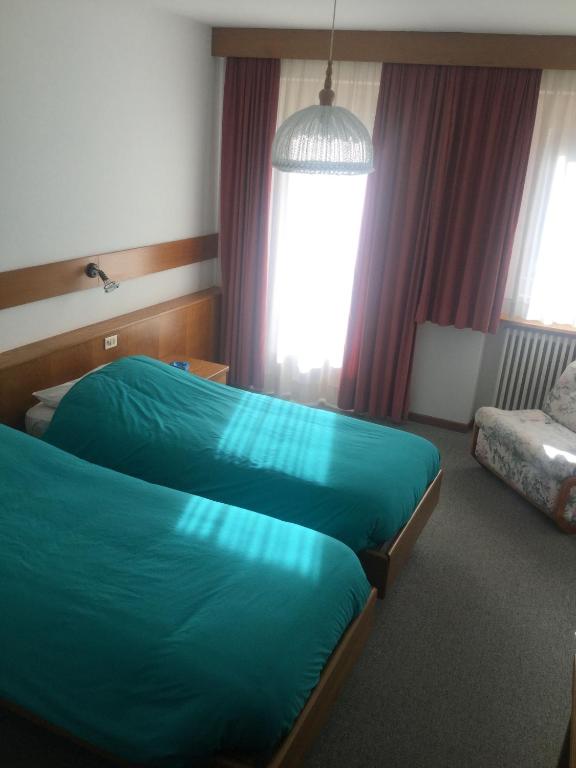 Postel nebo postele na pokoji v ubytování Hotel Alpenrose