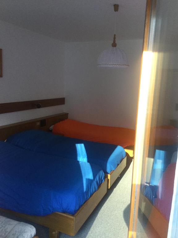 Postel nebo postele na pokoji v ubytování Hotel Alpenrose