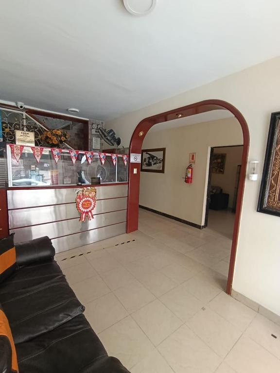 a living room with a couch in a room at ISIS HOTEl in Tumbes