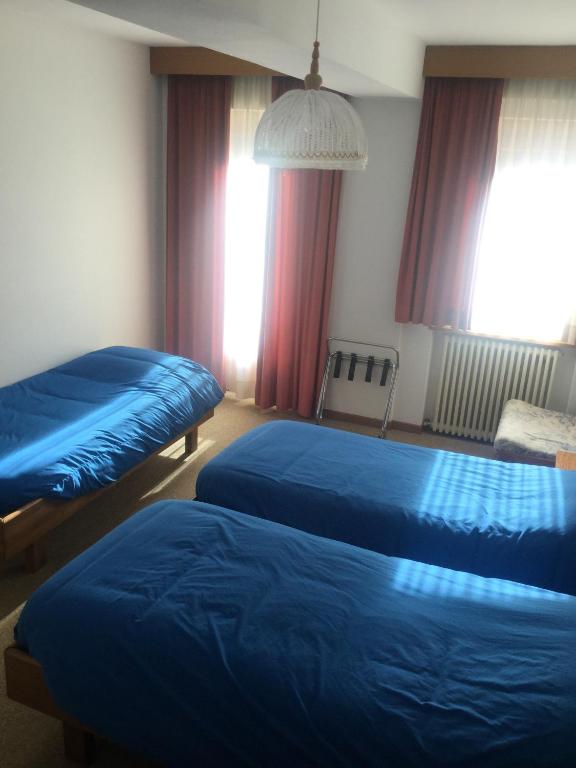 Postel nebo postele na pokoji v ubytování Hotel Alpenrose