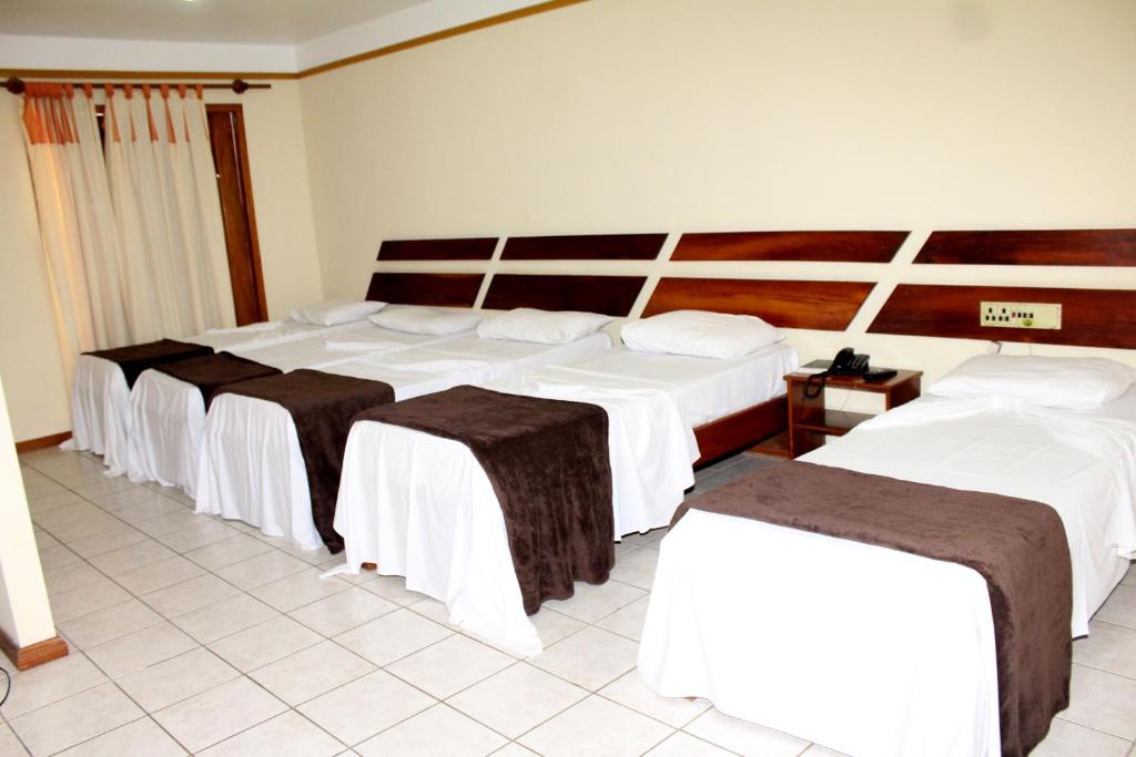 Postel nebo postele na pokoji v ubytování Coroa Bella Praia Hotel