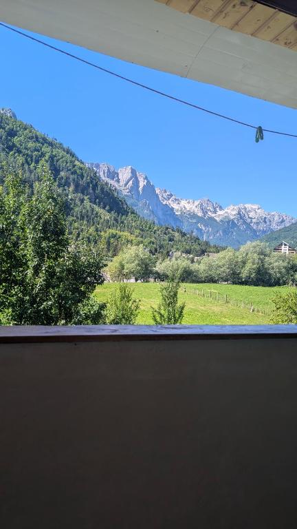 a view of a mountain range from a window at Guests house, Artani in Valbonë