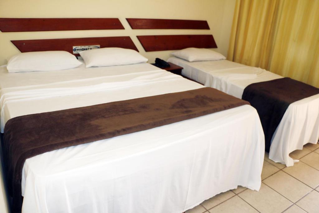 Postel nebo postele na pokoji v ubytování Coroa Bella Praia Hotel