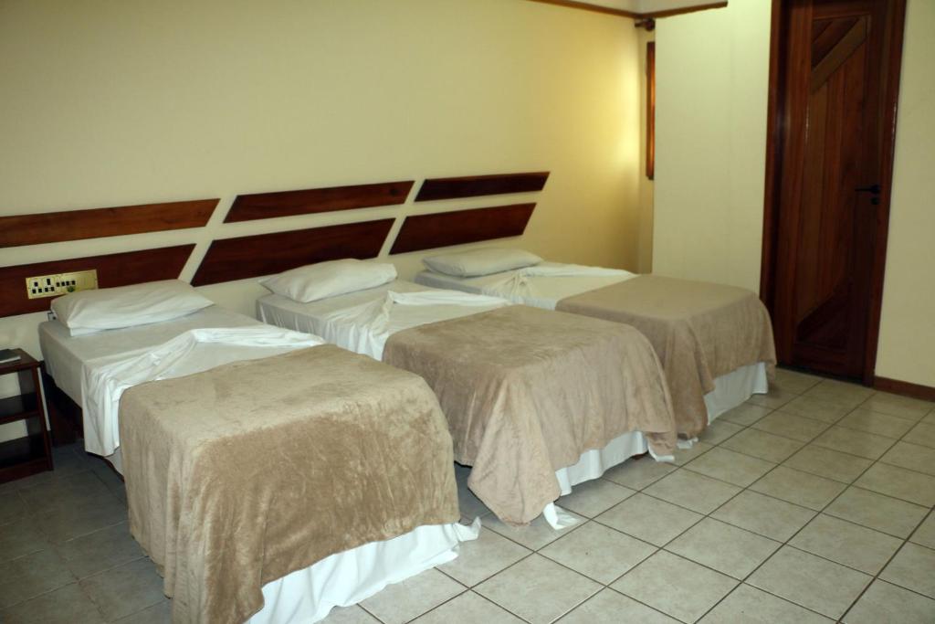 Postel nebo postele na pokoji v ubytování Coroa Bella Praia Hotel