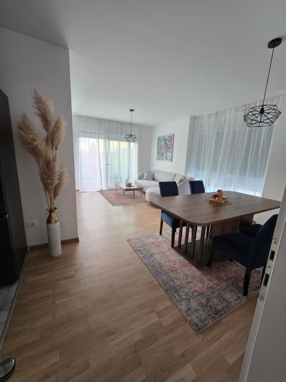a living room with a dining table and a couch at Mare Ann in Ljubuški