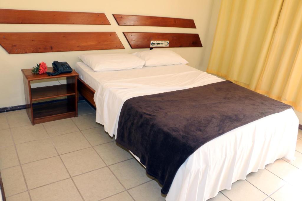 Postel nebo postele na pokoji v ubytování Coroa Bella Praia Hotel