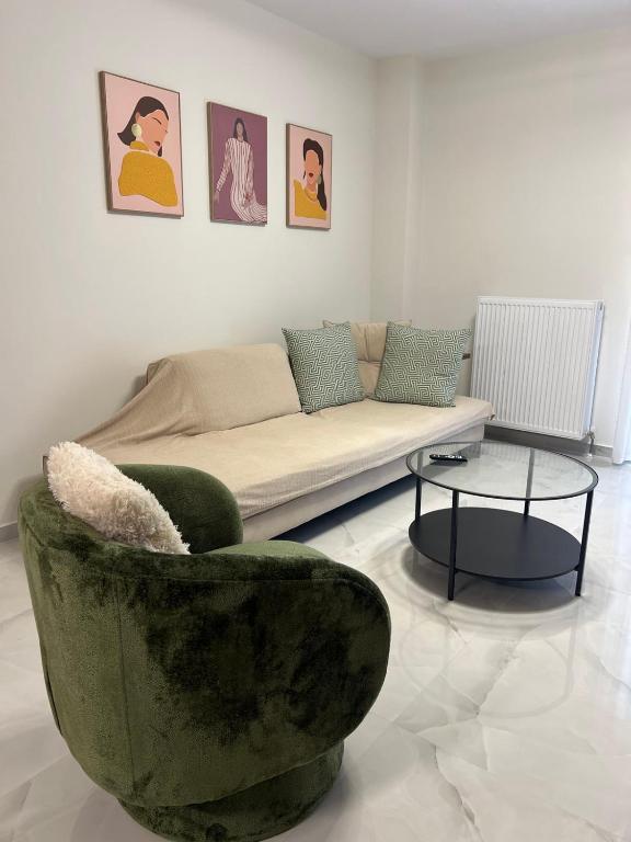 a living room with a couch and a table at GreveLuxious in Grevena