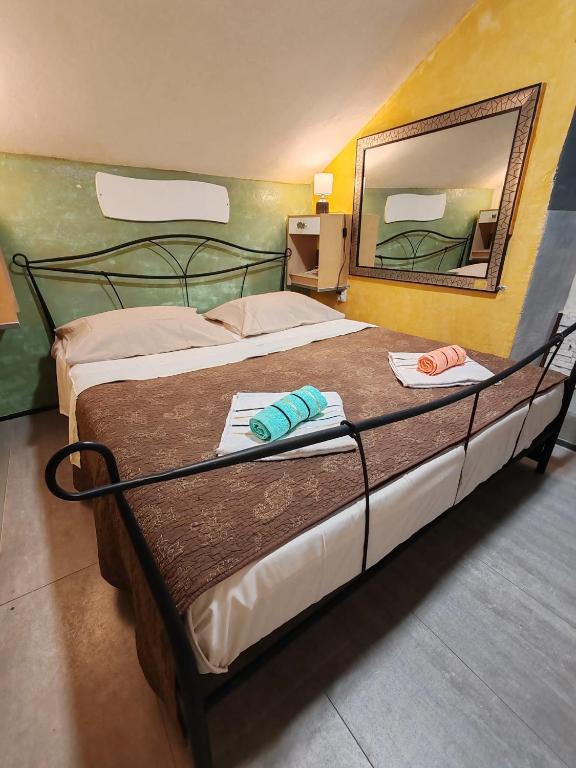 a bed with a mirror and two towels on it at Inspiration room - Toć in Split