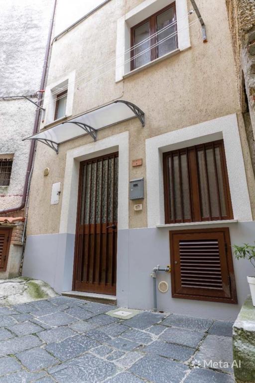 a building with two doors on the side of it at Pietramarina162 in Camerota