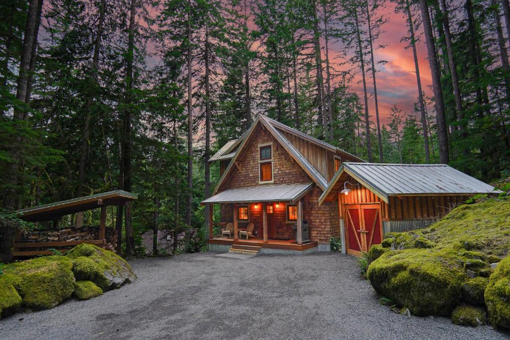 a cabin in the middle of a forest at The Shuksan in Deming