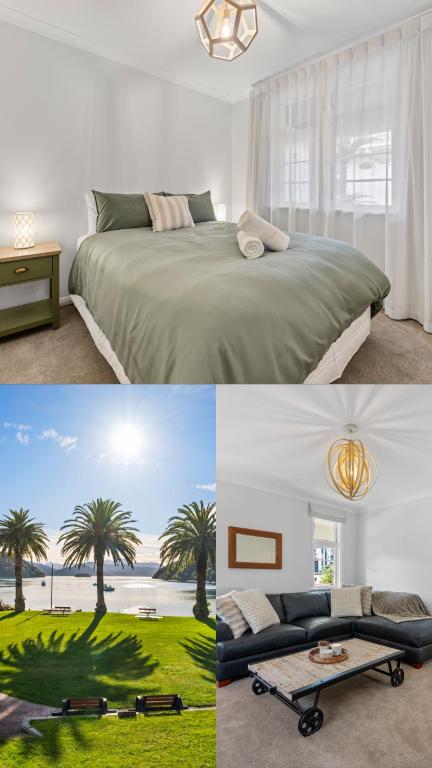 a bedroom with a large bed and palm trees at Central Art Deco #5 in Picton