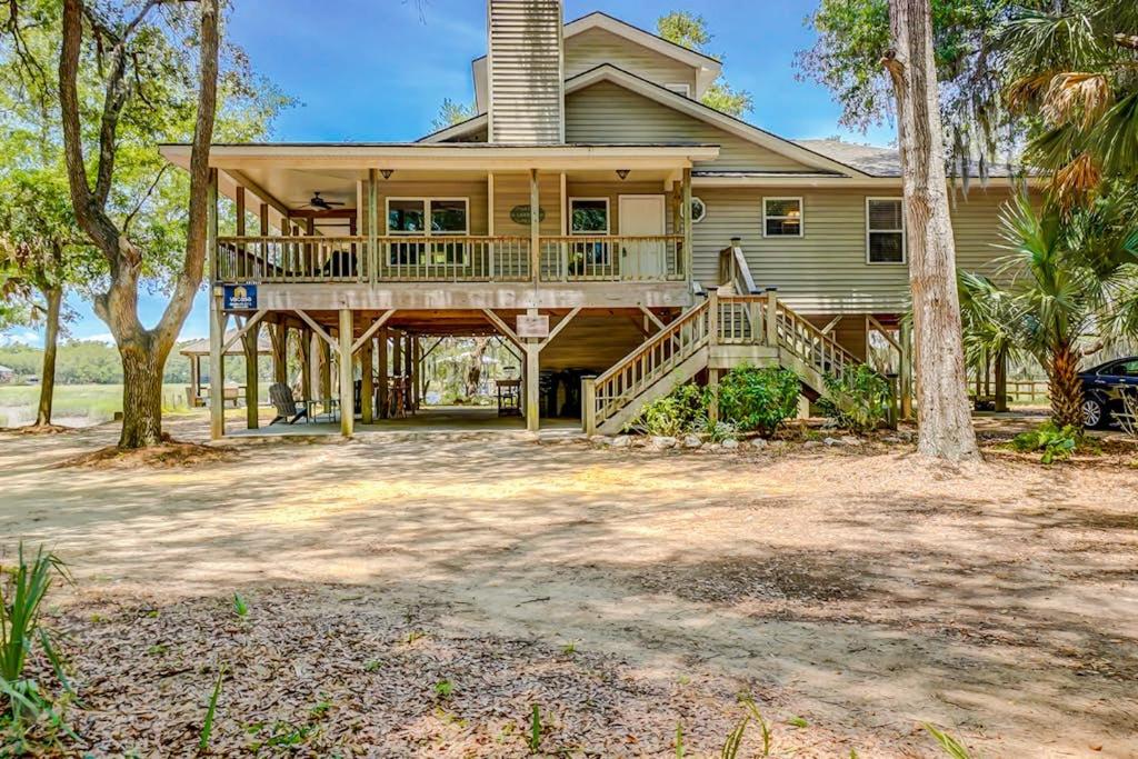 a large house with a wrap around porch at In Spite of Ourselves in Edisto Beach