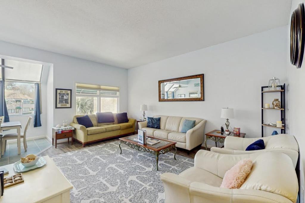 a living room with two couches and a table at Anchorage 7444 in Hilton Head Island