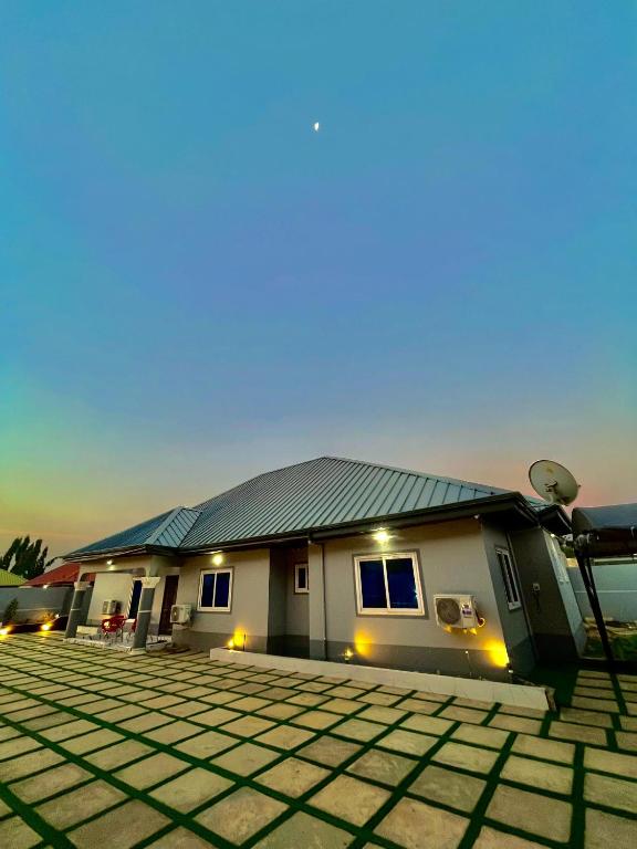a house with a solar roof on a lot at Dreamland prestige Homes in Sasabi