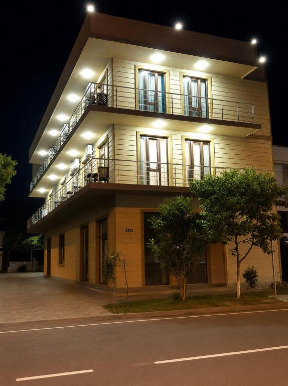 a large building with lights on the side of it at Sunny Hotel in Kobuleti
