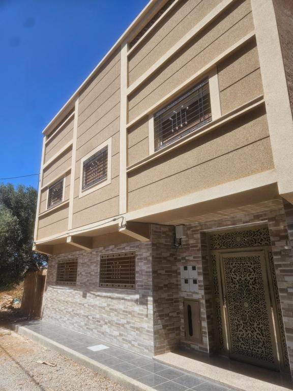 a building with a door on the side of it at Aerport arwi accom in Nador Airport