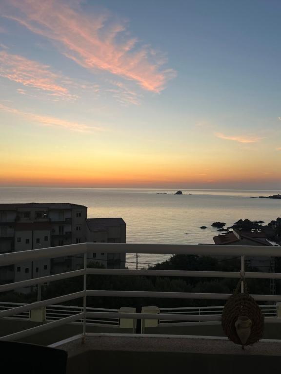 a view of the ocean at sunset from a building at T2 vue sur mer in Bejaïa