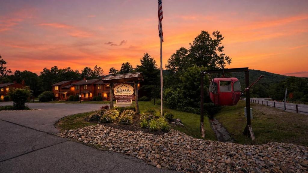 a lodge with an american flag and a sign at Lies by AvantStay in North Creek