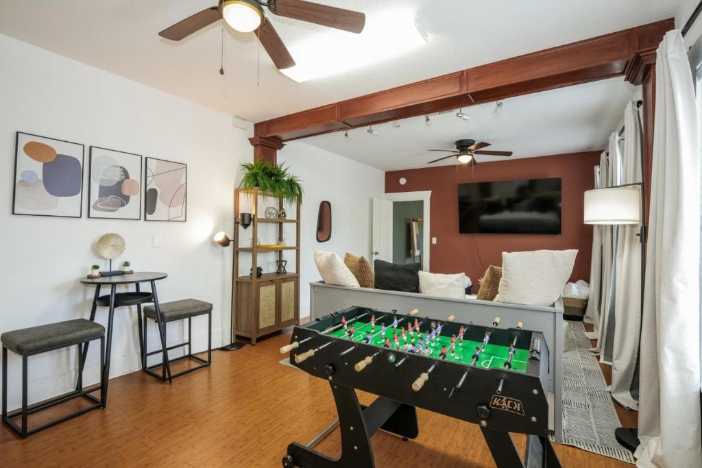 a living room with a foosball table at Updated 1 BR Home - Steps to 7th Ave in Tampa