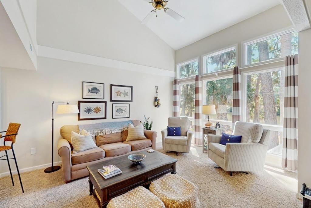 a living room with a couch and a table at Egrets Pointe 491 in Edisto Beach