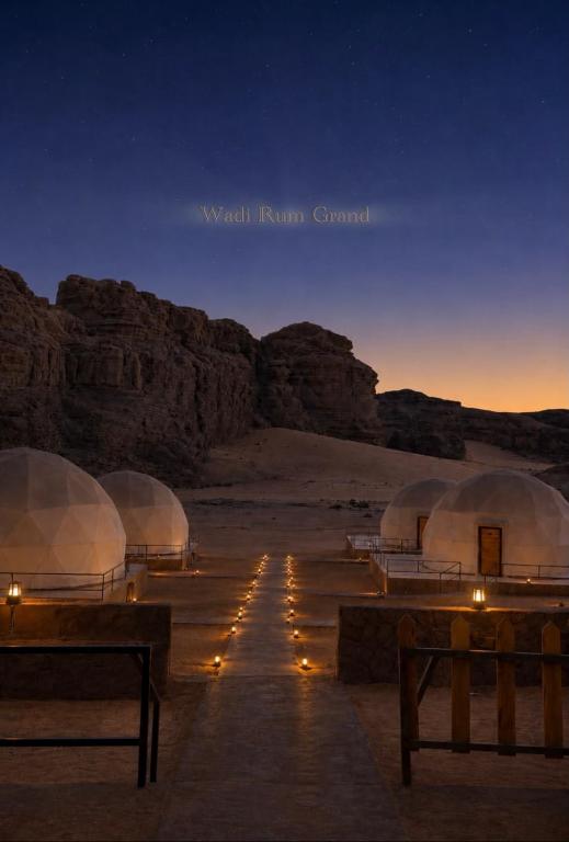 a group of domes in the desert at night at WADI RuM GRAND in Wadi Rum