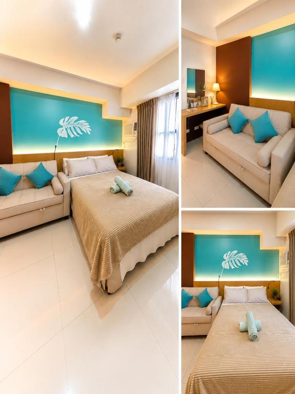 a hotel room with two beds and a couch at Nico's Studio Condo in Cebu City