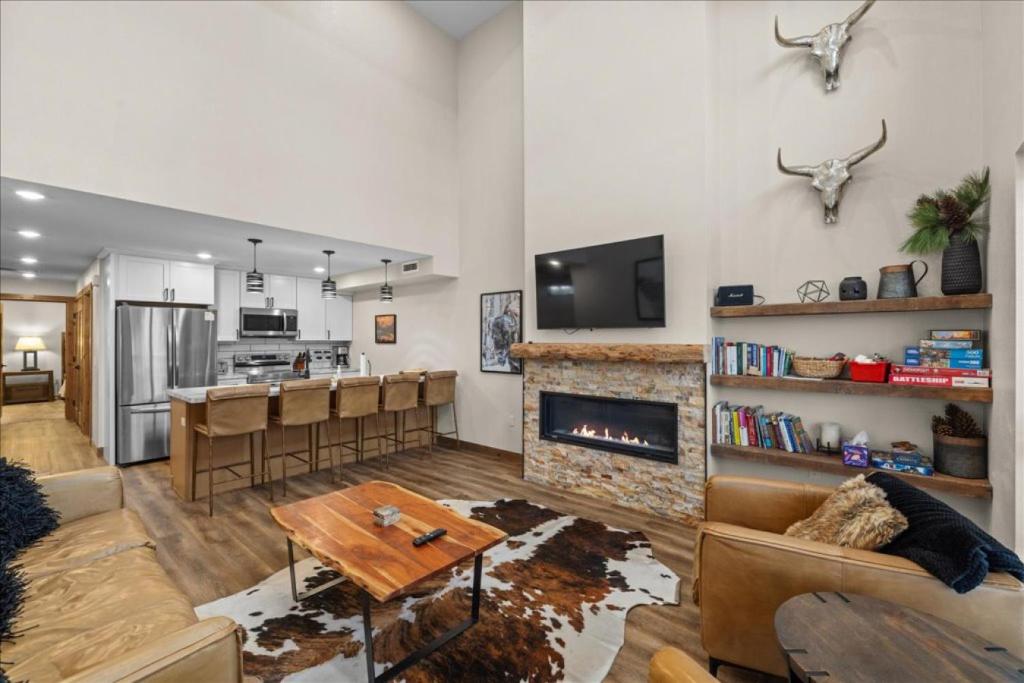 a living room with a couch and a fireplace at Luxury Red Lodge Retreat Hot Tub Downtown in Red Lodge