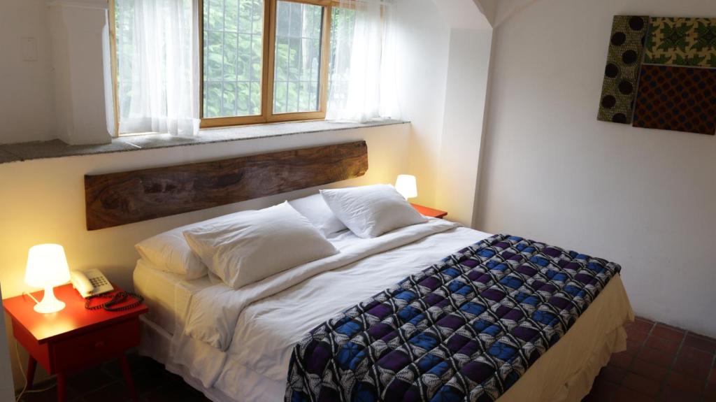 Postel nebo postele na pokoji v ubytování Iguanazu Bed & Breakfast