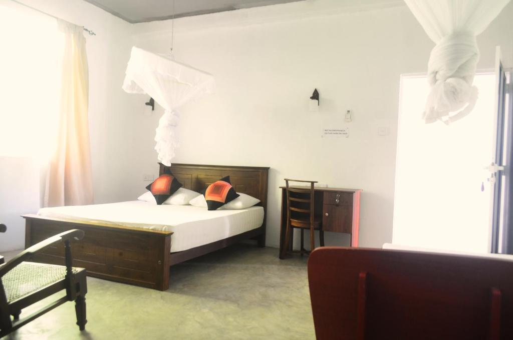 Postel nebo postele na pokoji v ubytování Holiday Inn Unawatuna